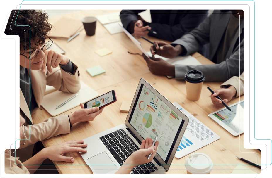 Picture of a table and a persons while working on sketches of website wireframes and post-it notes