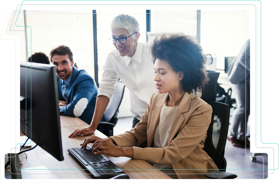 Group of people collaborating at desks with computers