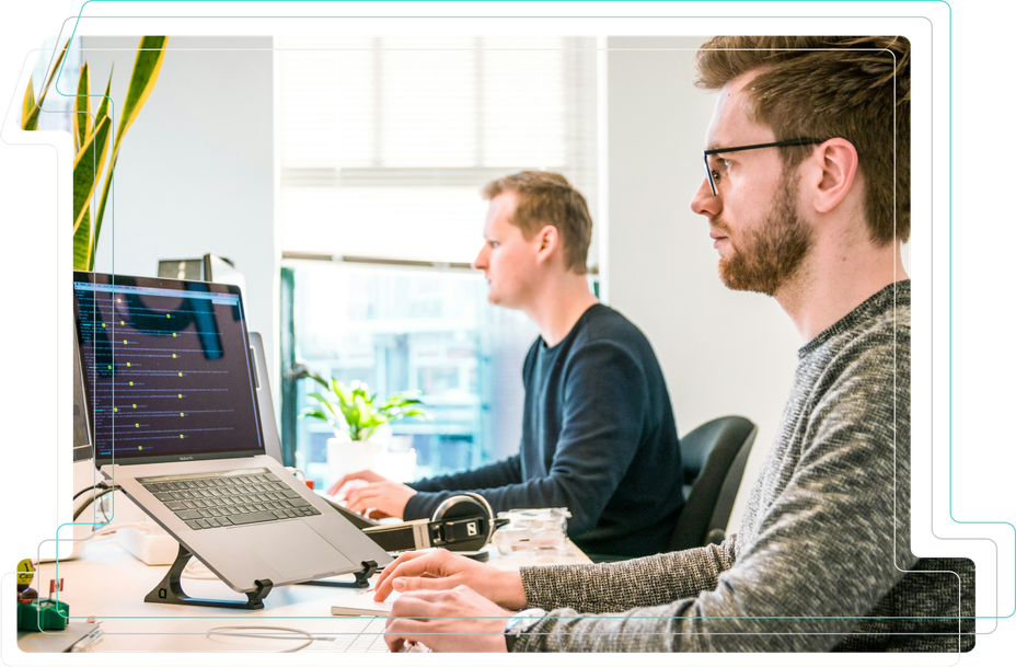 Two men working at computers